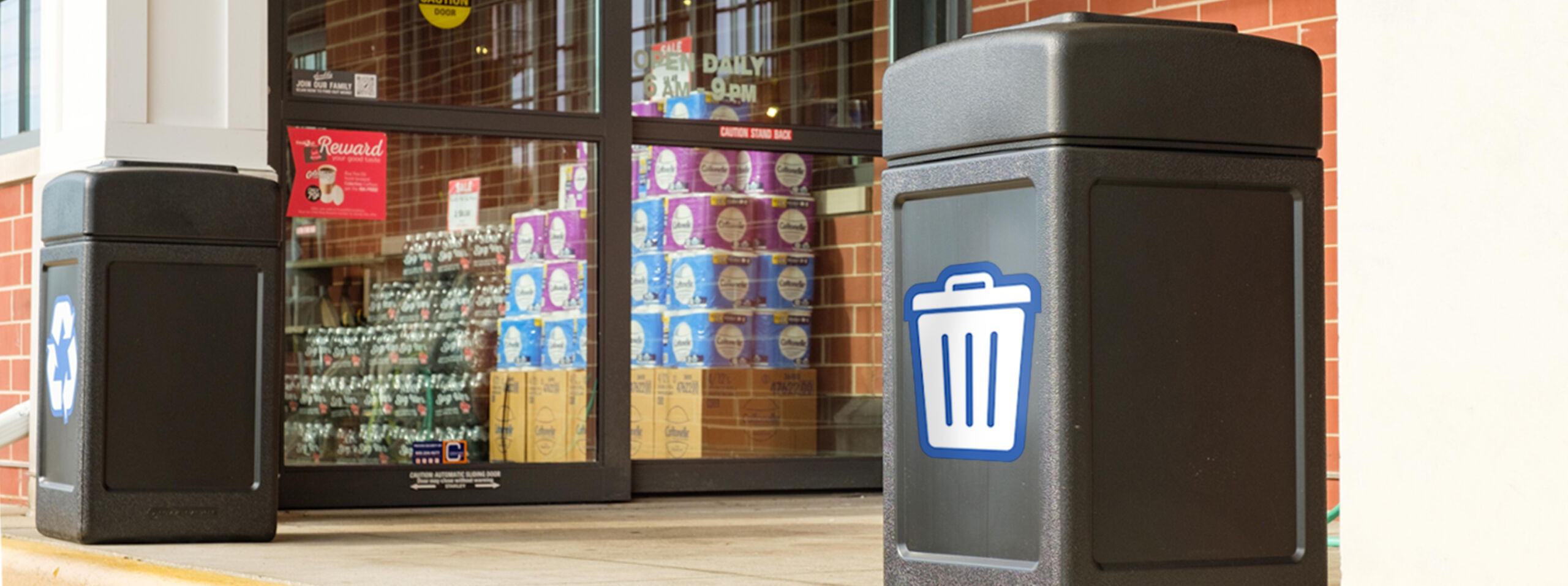 trash and recycling receptacles positioned in front of a convenience store forecourt